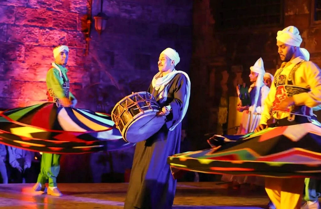Tanoura dancer spinning in a colorful skirt at Wekalet El-Ghouri in Cairo